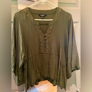 Forest green top with wide arms. Loose fit.